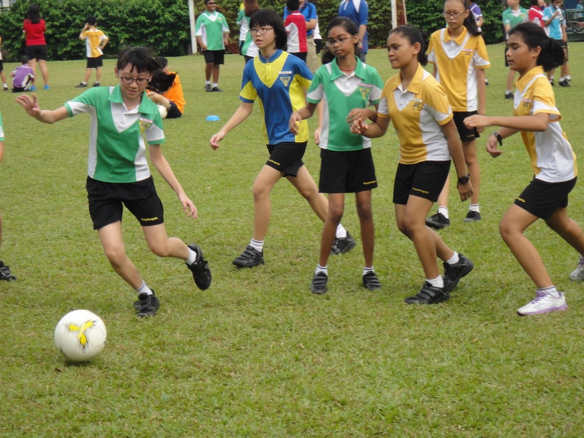 
P3 to P6 Sports Fiesta Upper Primary pupils taking part in a game of football, one of the six games carried out for the Sports Fiesta.